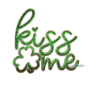 May include: Green and gold sequin iron-on patch with the words "kiss me" and a shamrock.