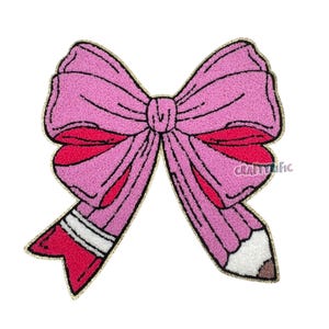 May include: A pink bow-shaped patch with a pencil design. The bow is a textured, light pink color with darker pink accents. The pencil has a red eraser, white stripes, and a brown tip. The patch has a gold border and the text "CraftyTific".