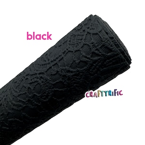 May include: Black lace fabric with a textured pattern. The fabric is rolled up and the word "black" is written in pink letters above the fabric.