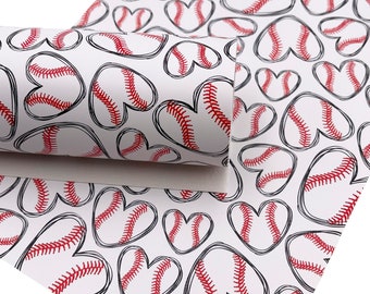 May include: White fabric with a repeating pattern of red and black baseballs in the shape of hearts.