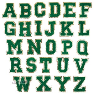 May include: Green felt letter patches with gold glitter trim. The letters are in a varsity style font. The letters are A through Z.