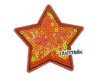 May include: A star-shaped patch with a pink, orange, and yellow iridescent sequin design. The patch is outlined in a brown thread.