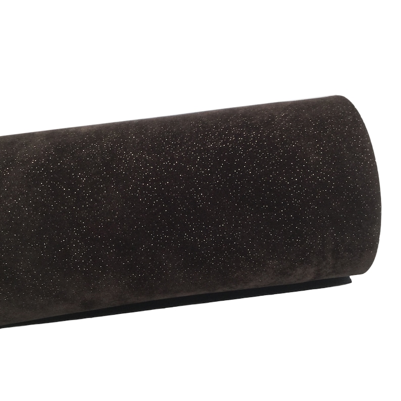May include: A roll of dark brown faux suede fabric with a subtle sparkle finish.