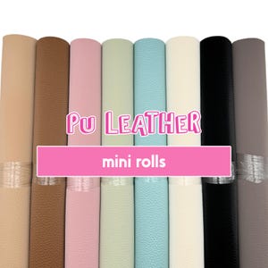 May include: A set of ten mini rolls of PU leather in various colors, including beige, brown, pink, light green, light blue, white, black, and gray. The rolls are labeled "PU Leather mini rolls".