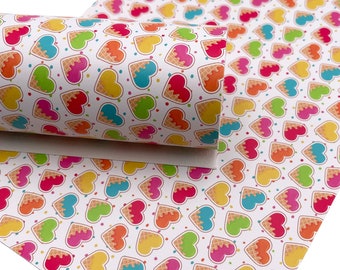 May include: White faux leather sheet with a repeating pattern of colorful ice cream cones in the shape of hearts. The ice cream is in shades of pink, blue, green, and yellow with a waffle cone texture.