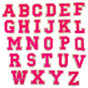 May include: A set of 26 pink felt letters with gold glitter outlines. The letters are in uppercase and are arranged in alphabetical order.