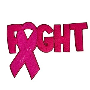 May include: Pink ribbon with the word "FIGHT" in pink letters. The ribbon is a symbol of breast cancer awareness.