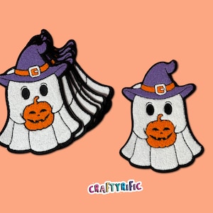 May include: Set of five purple and white felt ghost Halloween patches with a witch's hat and holding a jack-o-lantern.