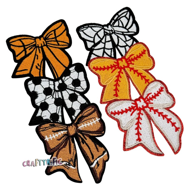 May include: Set of six embroidered iron-on patches featuring various bow designs. The bows are in black and white, orange, yellow, and red with white stitching. The patches are perfect for adding a touch of whimsy to clothing, bags, or other fabric items.
