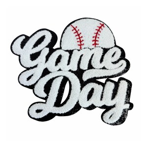 May include: White felt applique patch with the words "Game Day" in a black outline and a white baseball with red stitching on top.