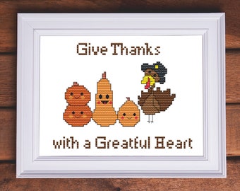 May include: Cross stitch pattern featuring a turkey, pumpkins, and the text "Give Thanks with a Greatful Heart".