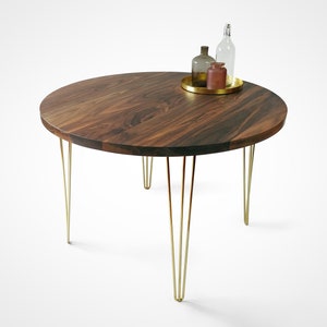 MOKU - round dining table made of solid American walnut wood with brass color hairpin legs