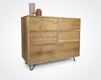 May include: A wooden dresser with six drawers and black hairpin legs. The dresser is made of light wood with a natural finish.