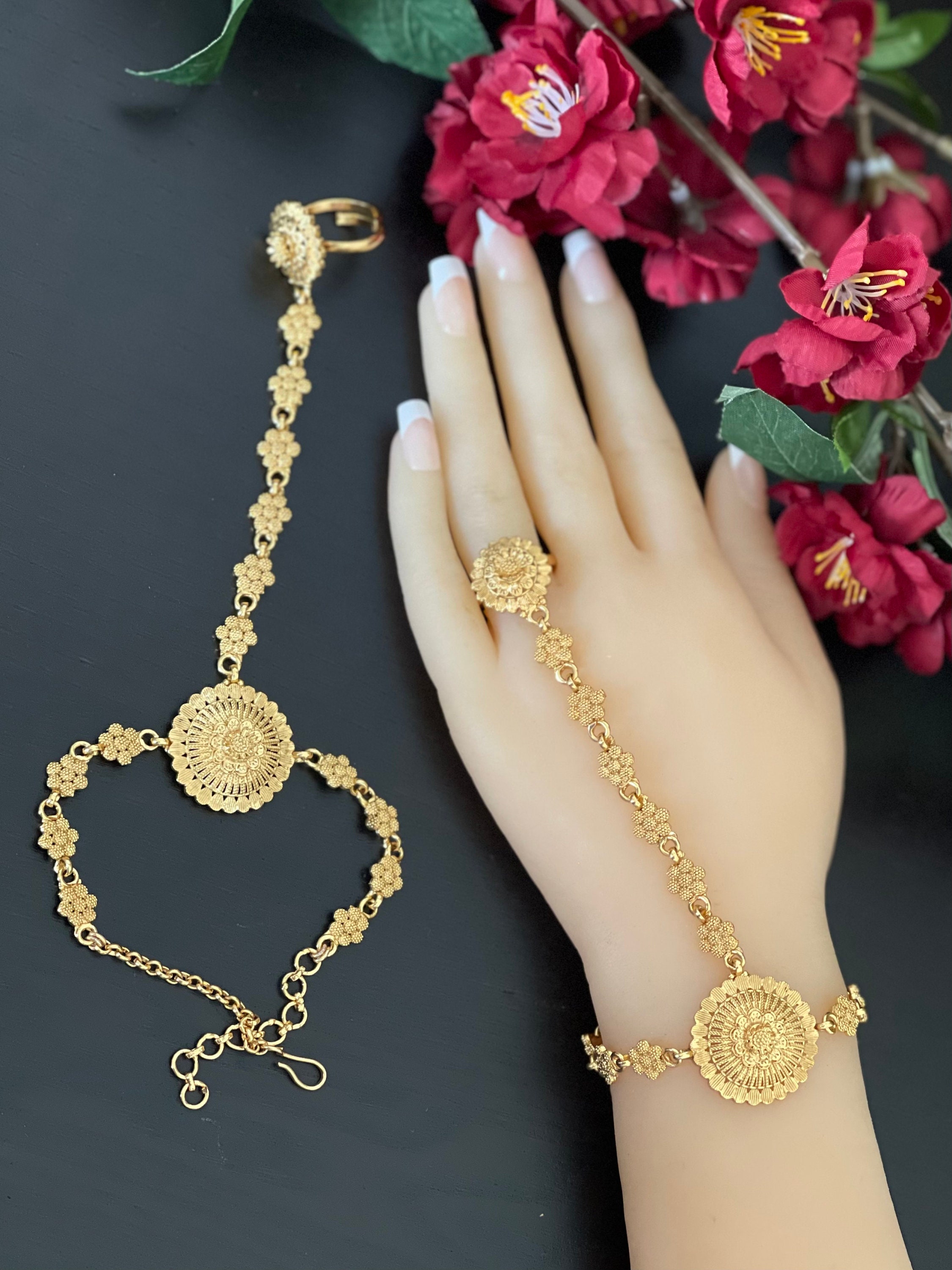 A Pair of Gold Hathphool Haathphool Bracelet Ring Combo Gold