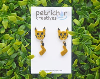 Pendientes colgantes con cara y cola de Pikachu