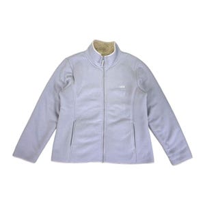 May include: A light blue fleece jacket with a full-length zipper and two front pockets. The jacket has a high collar with a tan fleece lining. The brand name is embroidered on the chest. The jacket is a casual outerwear garment.
