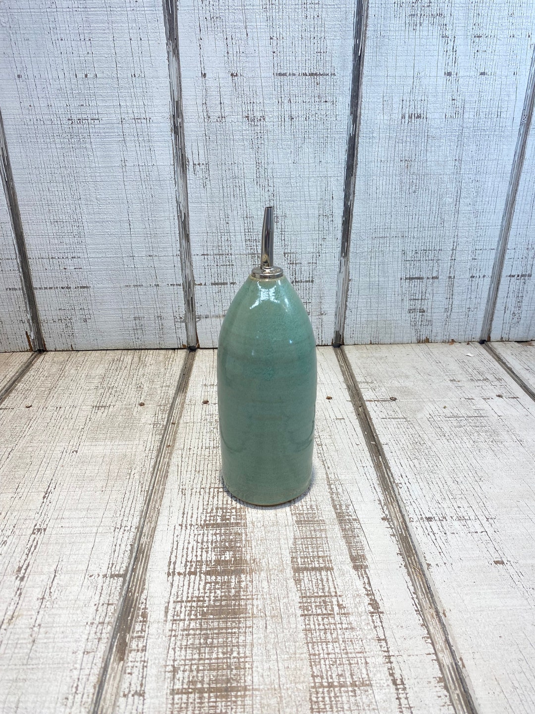 Green and Brown Oil Pourer
