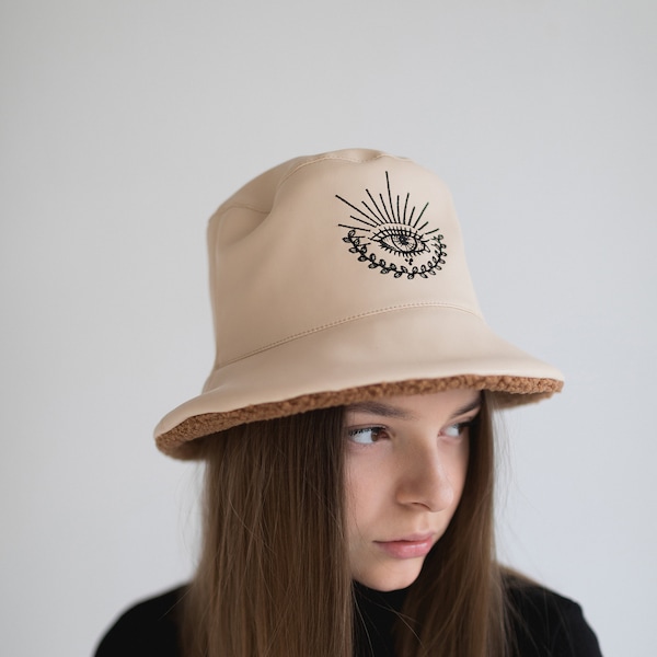 Warm winter vegan leather white bucket hat with faux fur and custom embroidery | Bucket hat for women with eye pattern | Ukrainian brand