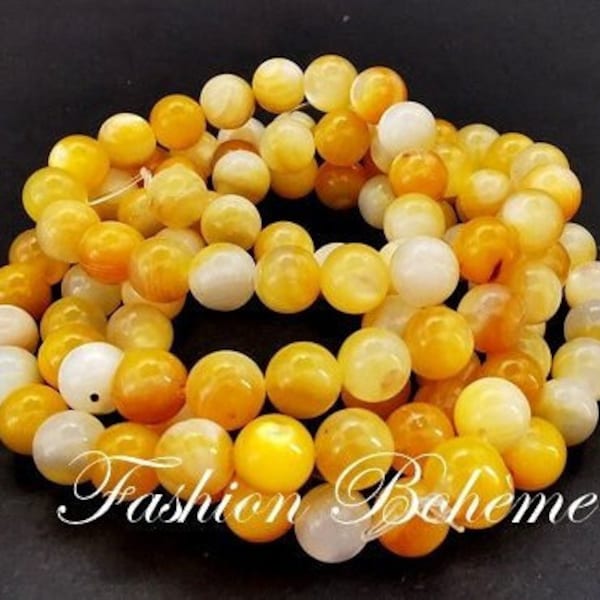 x 10 perles  naturelles de coquillage de mer jaune 7 mm