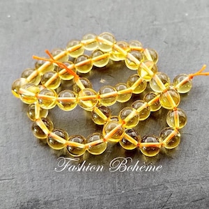 X 1 strand natural Citrine beads light yellow crystal (6.4 mm x 60 beads) (8.5 mm x 45 beads)