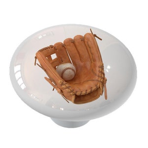 May include: A brown leather baseball glove with white stitching and a white baseball inside.