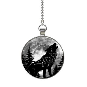 May include: A silver chain with a round pendant featuring a black silhouette of a wolf howling at the moon. The moon is depicted as a full moon with clouds in the background. The pendant is surrounded by a silver border.