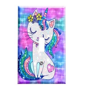 May include: A light switch cover featuring a white unicorn cat with a rainbow mane and tail, sitting on a pink, blue, and purple background with glitter accents.
