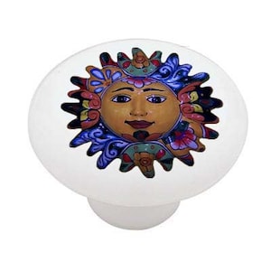 May include: A ceramic knob with a colorful sun design. The sun has a smiling face and is surrounded by flowers and swirls.
