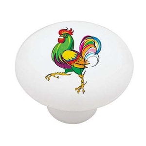 May include: A colorful ceramic knob with a rooster design. The rooster is green, yellow, purple, and red with a rainbow tail.