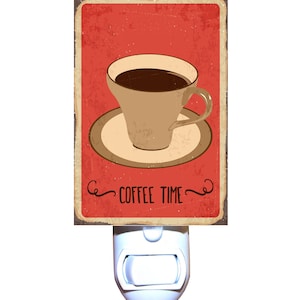 May include: A vintage-style night light with a red background and a white cup of coffee on a saucer. The text "COFFEE TIME" is written in a stylized font below the cup.