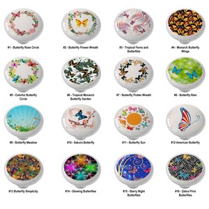 May include: A set of 16 ceramic knobs featuring various butterfly designs. The knobs are round and have a white background. The designs include butterflies in different colors, patterns, and arrangements, such as a butterfly rose circle, a butterfly flower wreath, tropical ferns and butterflies, monarch butterfly wings, a colorful butterfly circle, a tropical monarch butterfly garden, a butterfly flutter wreath, butterfly rain, a butterfly meadow, a sakura butterfly, a butterfly sun, an American butterfly, butterfly simplicity, glowing butterflies, starry night butterflies, and zebra print butterflies.