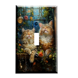 May include: Decorative light switch cover featuring a whimsical illustration of two fluffy cats basking in sunlight. The artwork includes a window with floral accents, a pocket watch, and vibrant colors, creating a charming and artistic design.