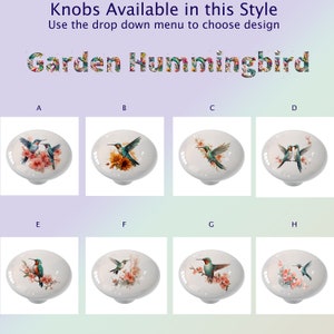 May include: Decorative ceramic knobs with hummingbird designs. The knobs are white with various watercolor illustrations of hummingbirds and flowers. Text at the top reads "Knobs Available in this Style" and "Garden Hummingbird".