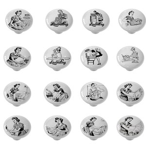 May include: Set of 12 white ceramic cabinet knobs with black and white illustrations of women doing laundry. The knobs feature vintage-style illustrations of women ironing, folding laundry, and doing other household chores. The knobs are labeled "Laundry" in a black script font.