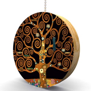 May include: A round wooden ceiling fan pull with a printed image of Gustav Klimt's "The Tree of Life". The image features a stylized tree with gold branches and swirls on a black background.