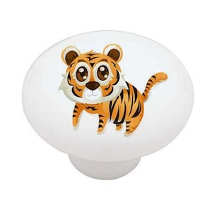 May include: White ceramic cabinet knob featuring a cartoon tiger illustration. The tiger has orange and black stripes, brown ears, and large brown eyes. The knob is round with a small base.
