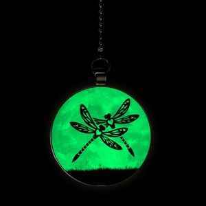 May include: A glow-in-the-dark ceiling fan pull with a green moon and two black dragonfly silhouettes.
