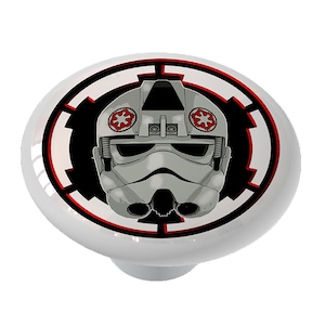 May include: A white ceramic knob with a black and red Imperial symbol and a white and gray TIE pilot helmet.