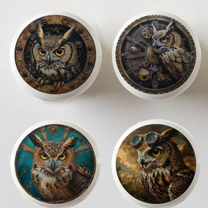 May include: Four round ceramic coasters featuring different images of owls with steampunk elements. The owls are depicted with intricate gears, cogs, and other mechanical details. One owl is wearing goggles.