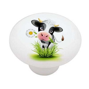 May include: A black and white cow with a pink nose is standing in a field of green grass. The cow is eating a white daisy.