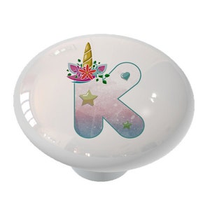 May include: White ceramic knob with a pastel blue, pink, and white unicorn letter K with gold stars and a unicorn horn and flower crown.