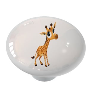 May include: A white ceramic knob with a cartoon giraffe illustration. The giraffe has brown spots and large eyes.