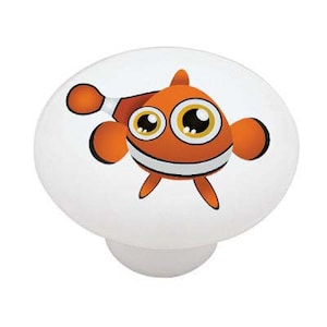 May include: A cartoon orange and white clownfish with big eyes and a wide smile. The fish is swimming to the right and has a white stripe around its body.