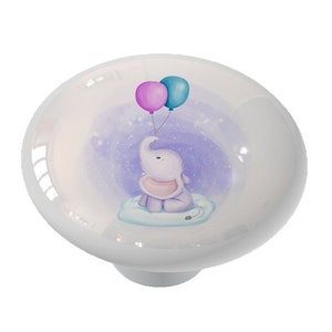 May include: A ceramic knob with a purple and blue balloon illustration of a baby elephant holding the balloons. The elephant is sitting on a cloud with a purple and white starry background.
