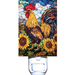 May include: A stained glass style night light featuring a rooster standing in a field of sunflowers. The rooster is yellow, red, and brown with a colorful tail. The sunflowers are yellow with brown centers.