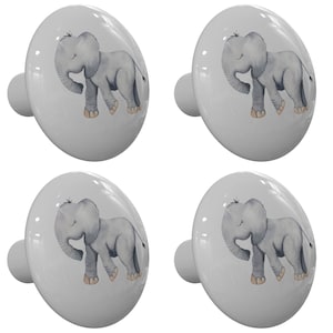 May include: Set of four ceramic cabinet knobs featuring a watercolor illustration of a gray elephant with closed eyes. The knobs are a light gray color with a white background.