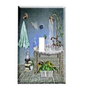 May include: A light blue bathroom wall with a wooden bathtub, a shower head, and a towel hanging on a hook. The bathtub is filled with water and bubbles. There are flowers in a white basket on the floor.