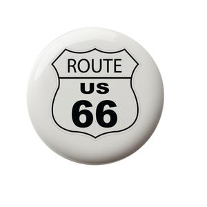 May include: White round button with a black and white Route US 66 sign. The sign is a shield shape with a pointed top and rounded bottom.