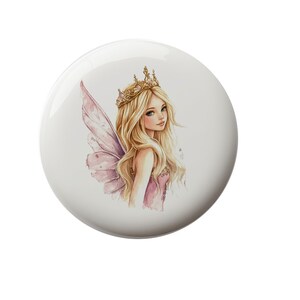 May include: A fairy with long blonde hair wearing a gold crown and a pink dress with wings. The fairy is illustrated in a watercolor style.