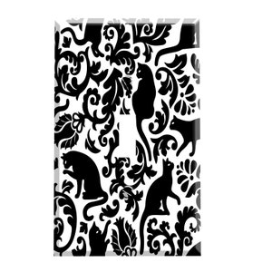 May include: Black and white light switch cover with a repeating pattern of cats and floral designs.